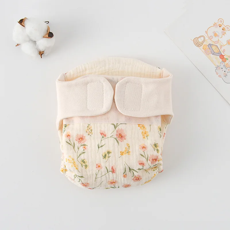 16_7b3f6103-fd3d-4fd1-8386-26434ef807eb ComfyCotton– Waterdicht&Veilig– Biokatoenen Oefenbroekjes Roze Bloemen / S (0-5kg) - 0-3 maanden | Educatief Speelgoed - Afbeelding 1