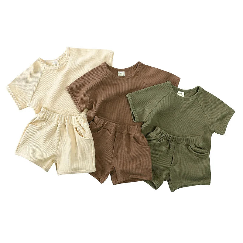 image_145_Baby_Boys_Girls_Clothing_Suit_Short_Sleeved_Cotton_Solid_Color_T_shirtShorts_Children_Clothing_Set_For_Summer_0 Mini Fashion™ - Zomer ribstof kledingsetje Beige / 90 (2-3 jaar) | Educatief Speelgoed - Afbeelding 1